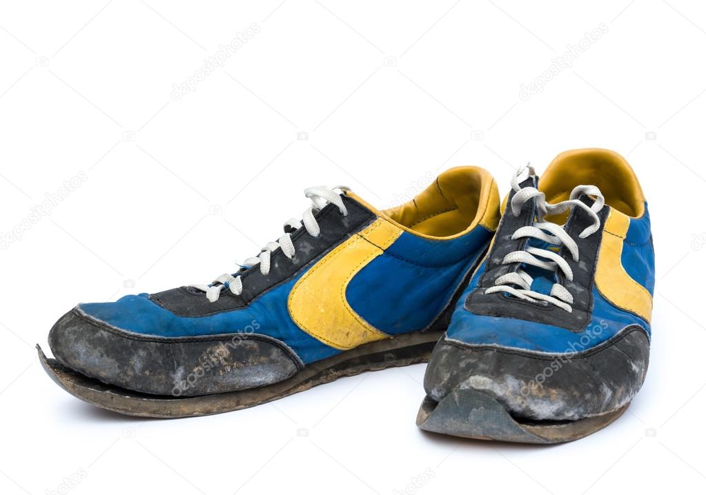 Pair of old shoes on white background