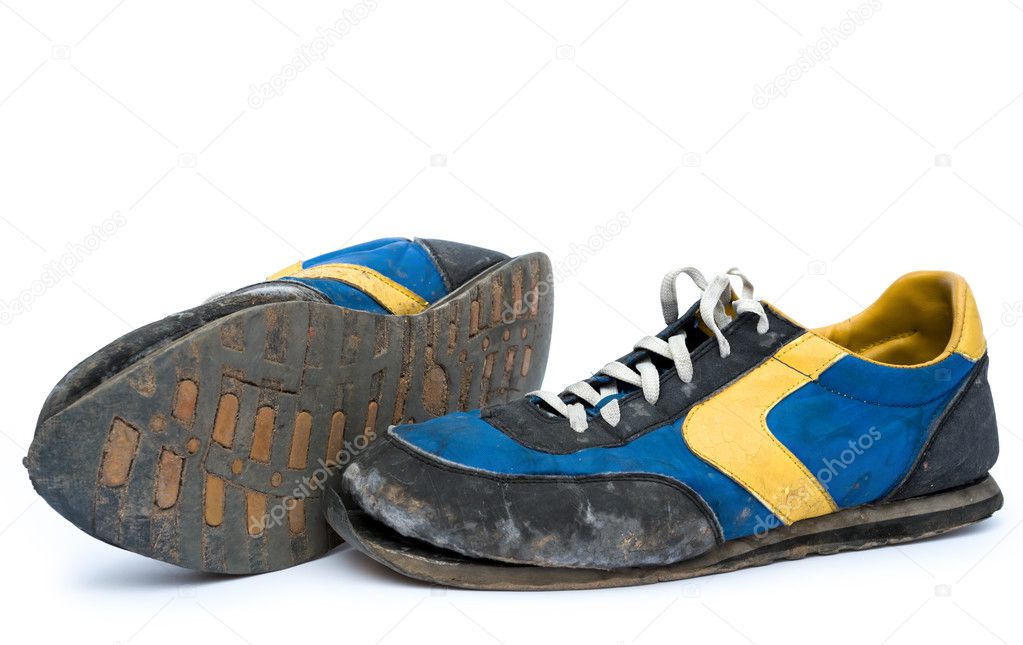 Pair of old shoes on white background