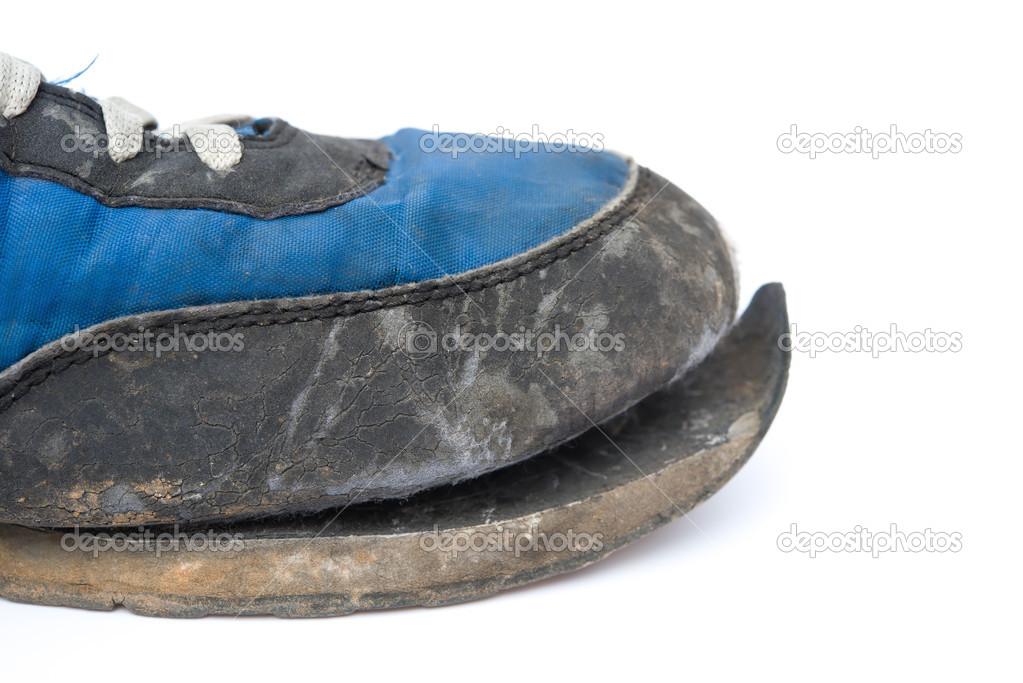 Close up of a broken shoe on white background