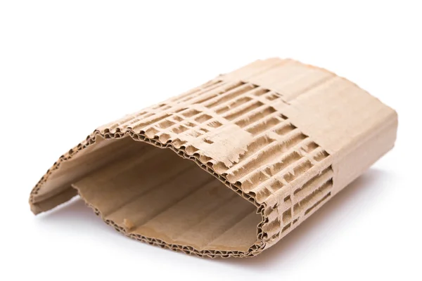 Piece of cardboard corrugated on white background — Stock Photo, Image