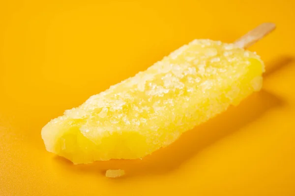 Angle View Fresh Yellow Popsicle Bite Yellow Background — Stock Photo, Image