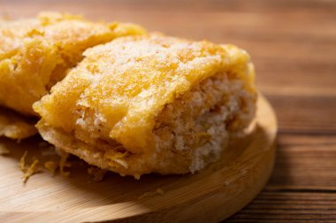 traditional Chinese sweet roll with deep fried glutinous rice and sesame and chrysanthemum