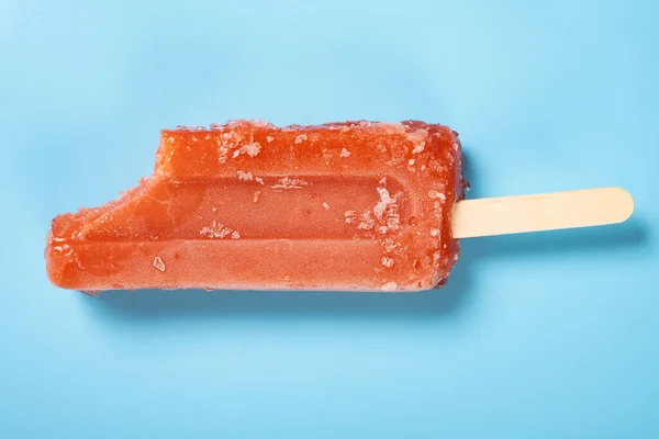 Top View Fresh Red Popsicle Bite Blue Background — Stockfoto