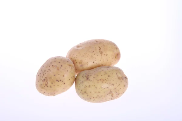 Три неочищений картопля — стокове фото