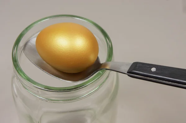 golden egg and spoon