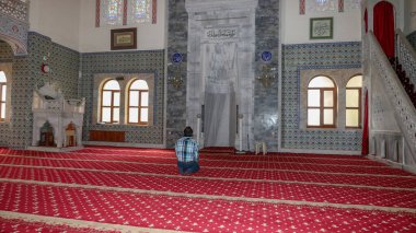 Muslim man alone a prayer in the Center Mosque in Ankara