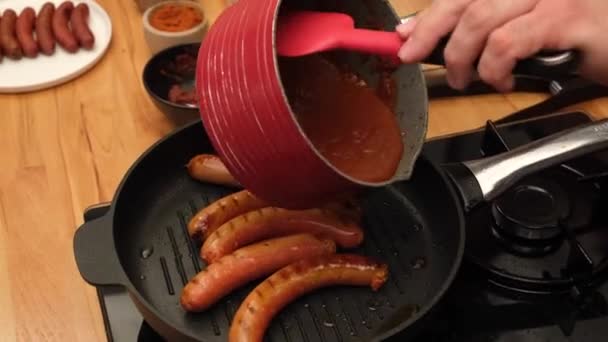 Cook Stirs Sausages Shovel Boiling Red Tomato Sauce Boiling Sausages — Stockvideo
