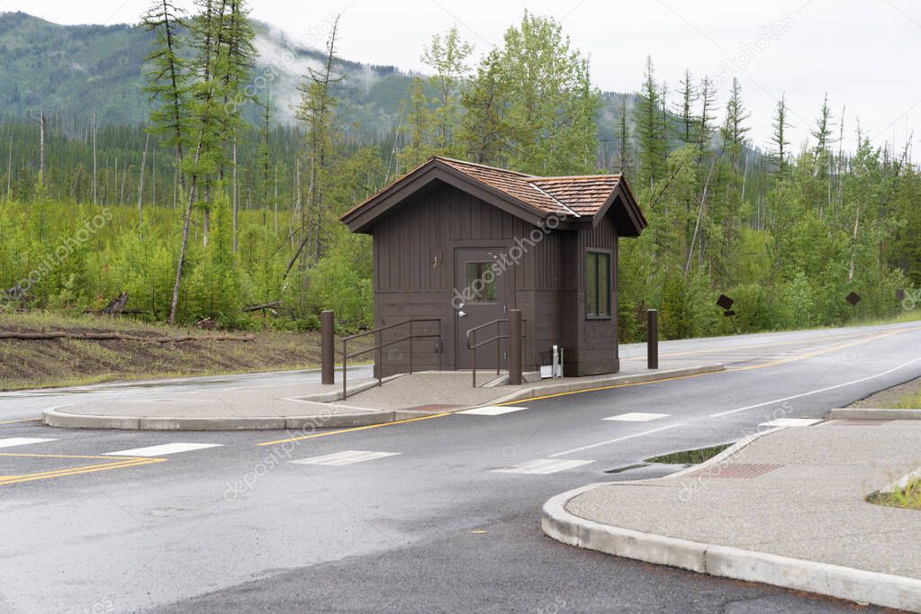 Camas Creek Entrance station in Glacier National Park on a rainy summer day