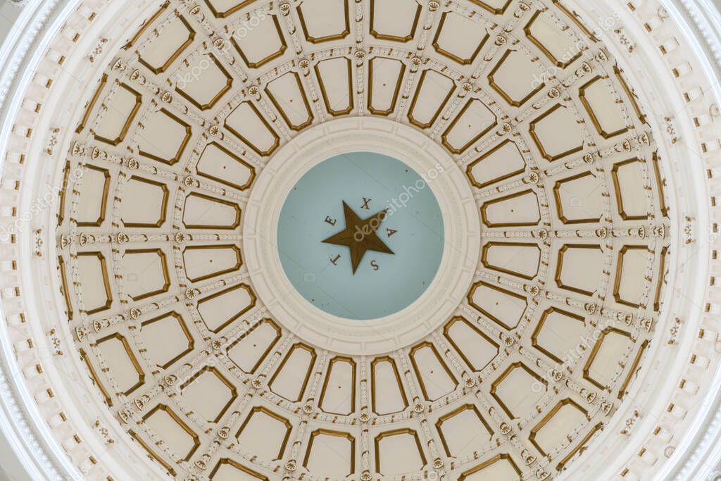 Austin, Texas - May 23, 2022: Inside the rotunda of the Texas State Capitol Building, the domed ceiling with the word Texas and lone star.