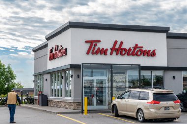 Pincher Creek, Alberta, Canada - July 6, 2022: Exterior of a Tim Hortons coffee shop, a popular chain restaurant in Canada