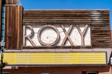 Shelby, Montana - July 2, 2022: The abandoned Roxy movie theater with its iconic neon sign on a sunny day