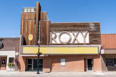 Shelby, Montana - July 2, 2022: The abandoned Roxy movie theater with its iconic neon sign on a sunny day