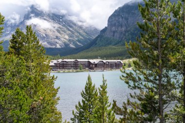 Montana, USA - July 4, 2022: Historic Many Glacier Hotel in Glacier National Park on an overcast rainy day
