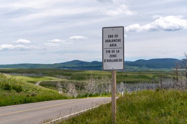 Sign noting the End of Avalanche Area along the Red Rock Canyon Parkway in Waterton Lakes National Park Canada