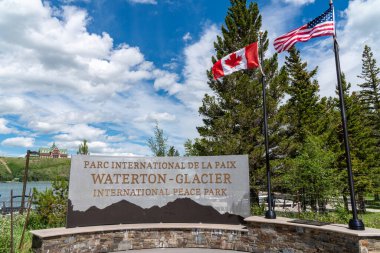 Waterton, Alberta, Canada - July 5, 2022: Sign for Waterton-Glacier International Peace Park clipart