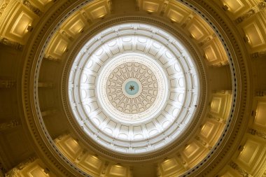 Austin, Texas - May 23, 2022: Inside the rotunda of the Texas State Capitol Building, the domed ceiling with the word Texas and lone star.