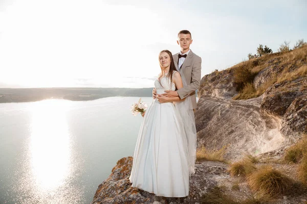 Wedding couple in Lake, happy.