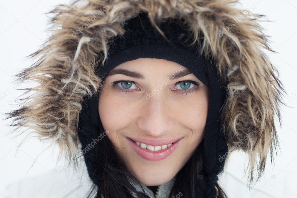 Close-Up Portrait of Beautiful girl in winter clothing