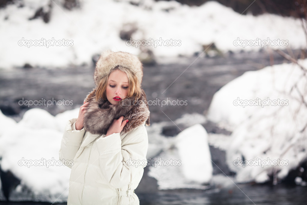 Beautiful girl in winter outdoors