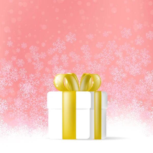 Geschenkpapier-Box auf rotem Schnee Hintergrund. Geschenk mit goldenen Schleifen — Stockfoto