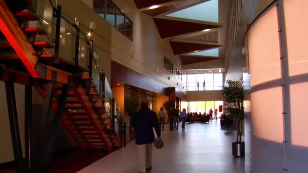 Jib shot of office lobby — Stock Video