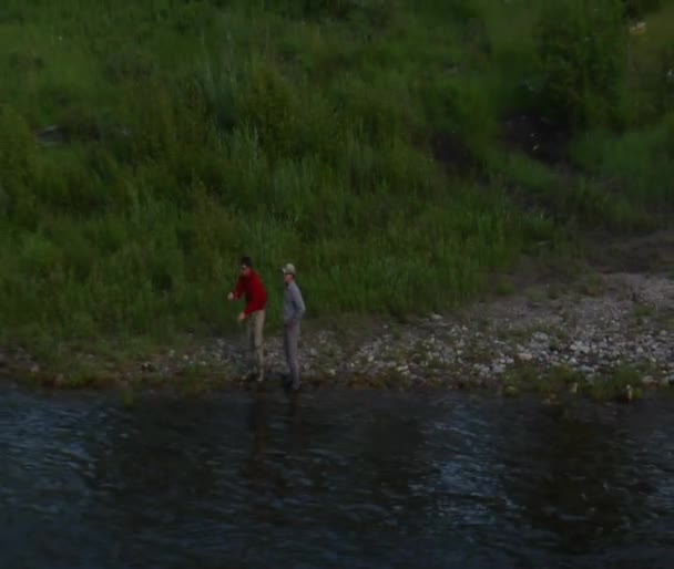 Aerial shot of two fly fisherman — Stock Video