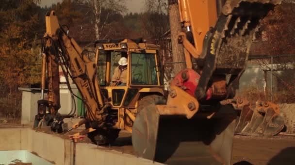 Backhoe and excavator working — Stock Video