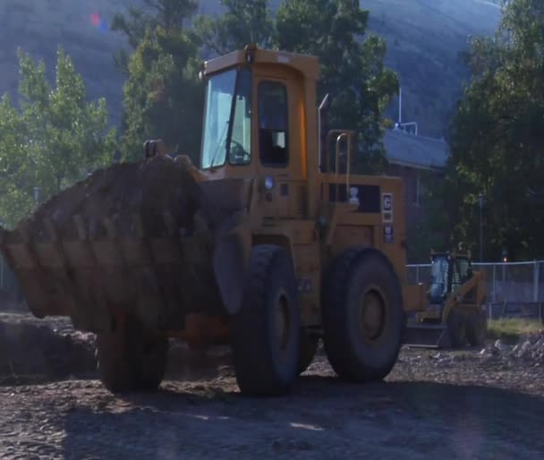 Front-end loader dumps dirt — Stock Video