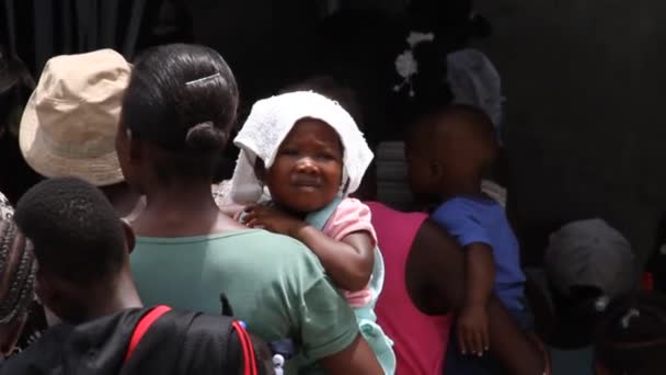 Lines of people at vaccination clinic in Haiti — Stock Video