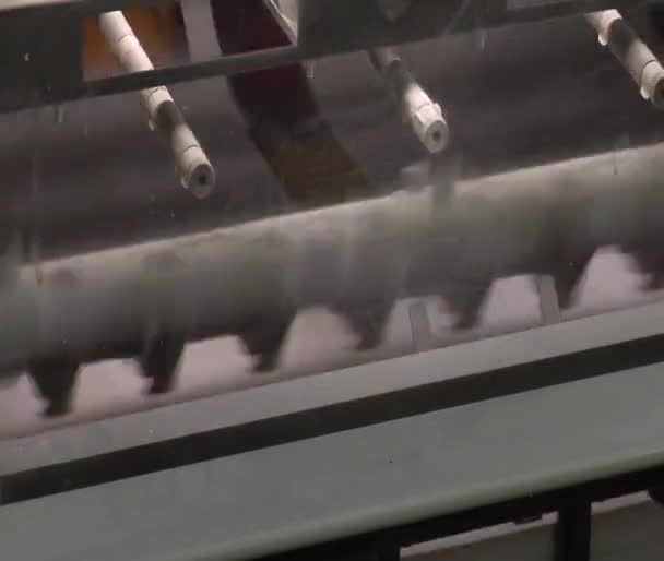 Close-up on printed materials and mechanical feeder on printing press — Stock Video