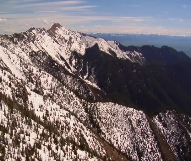 Snowy mountains, distant blue sky — Stock Video