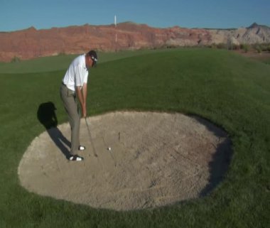 Man hitting a golf ball