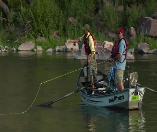 Fly fishing drift boat passing camera — Stock Video