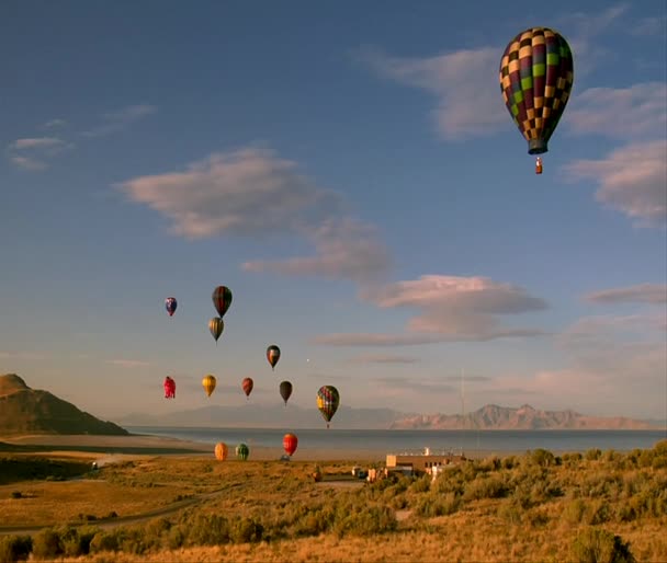 Hot air balloons lifting into the sky shot from basket — Stock Video