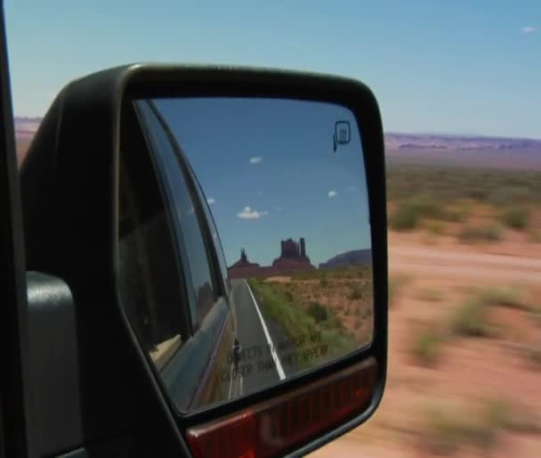 Monument Valley Highway in rearview mirror — Stock Video
