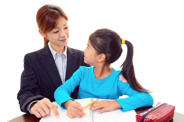 Profesora con chica estudiando . — Foto de Stock