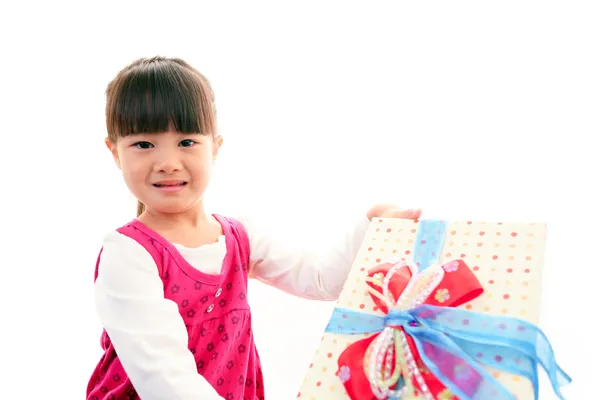 Joyful little girl holding present in hands — Stock Photo, Image
