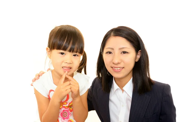 Улыбающийся учитель с маленькой девочкой — стоковое фото