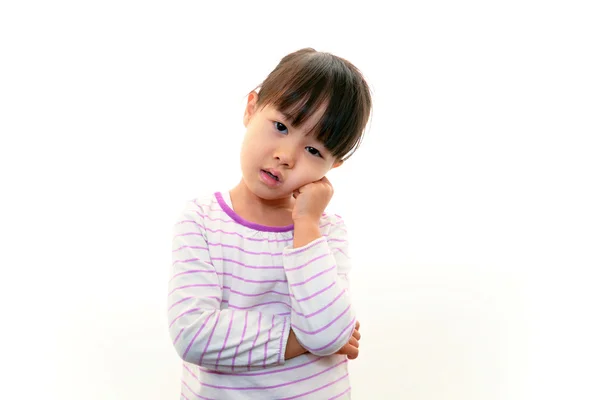 Little Asian girl uneasy look — Stock Photo, Image