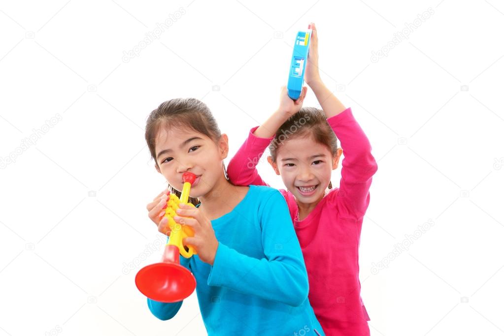 Smiling girls with musical instrument