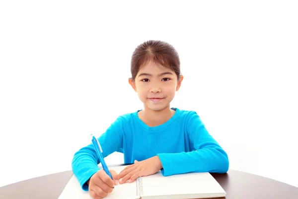 Ragazza che studia alla scrivania — Foto Stock