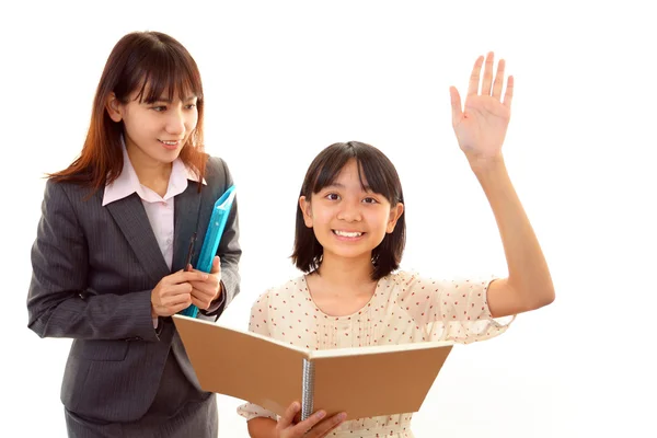 Lehrerin mit Mädchen beim Lernen. — Stockfoto