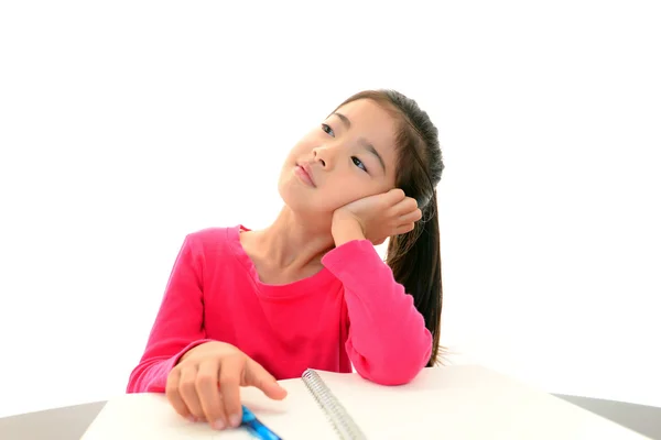 Girl studying at the desk being tired — Stock Photo, Image