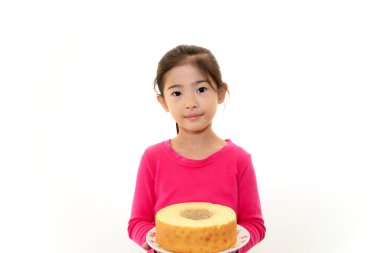 bir tatlı ile mutlu bir çocuk