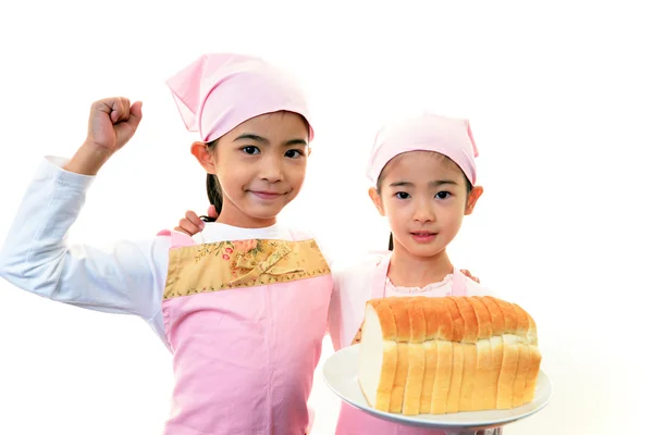 Children holding bread — Stock Photo, Image