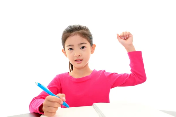 Menina feliz estudando na mesa — Fotografia de Stock