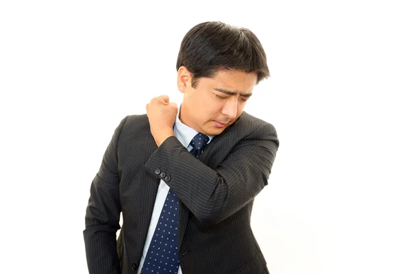 Uomo d'affari con dolore alla spalla . — Foto Stock