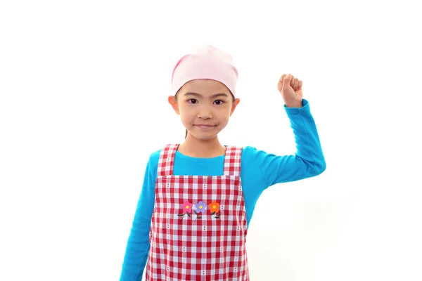 Uma menina vestindo um avental — Fotografia de Stock