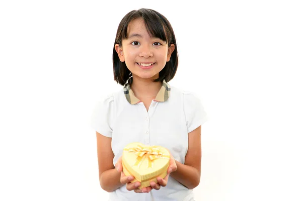 Girl smiling with present — Stock Photo, Image
