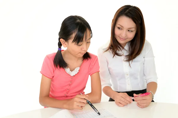 Δάσκαλος με το κορίτσι που σπουδάζουν. — Φωτογραφία Αρχείου